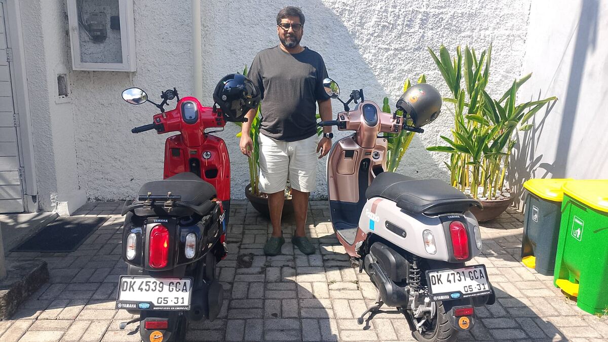 Red and cream Yamaha Fazzio motorbikes