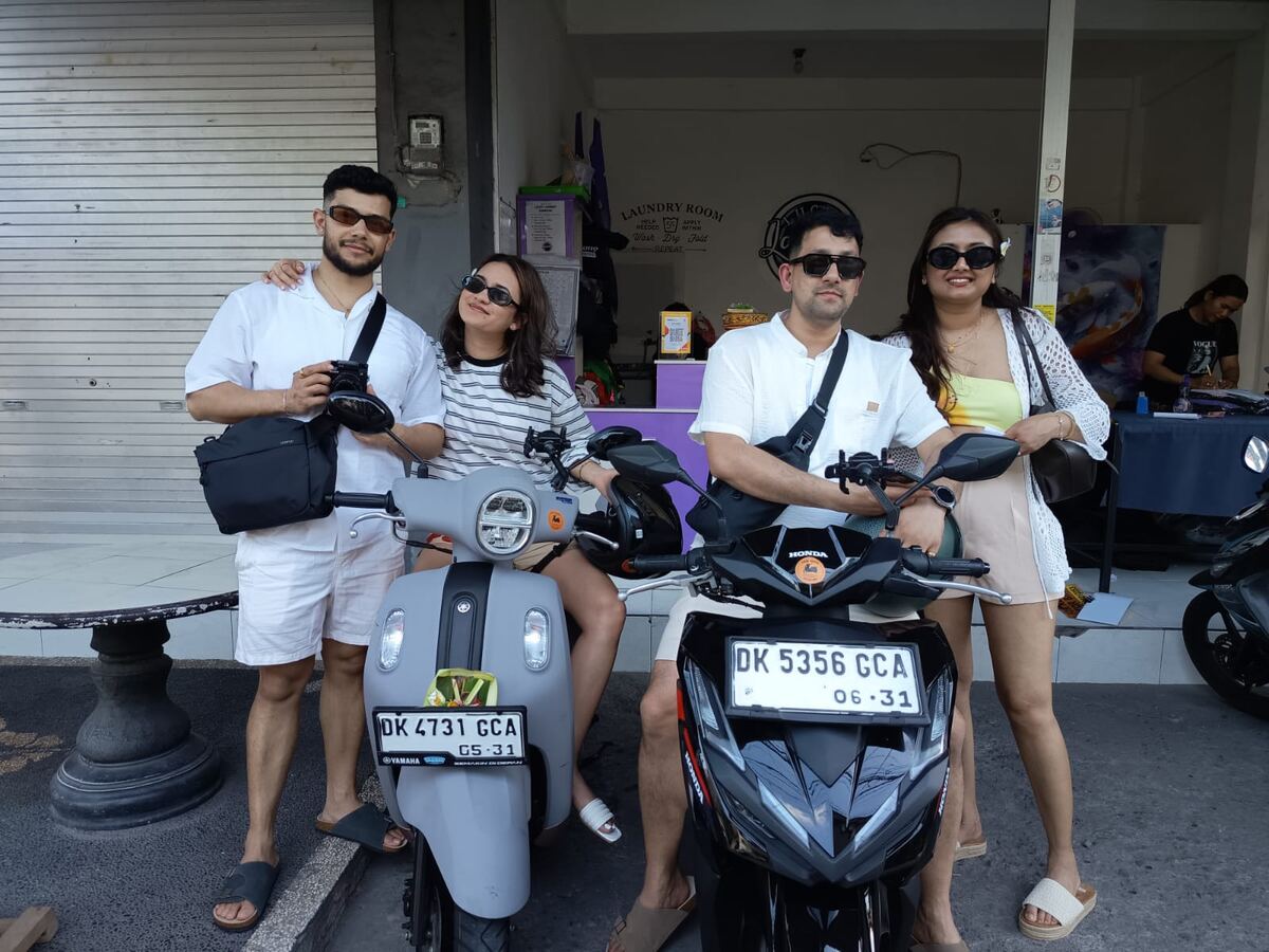 Friends picking up two motorbikes at Lucky Rental